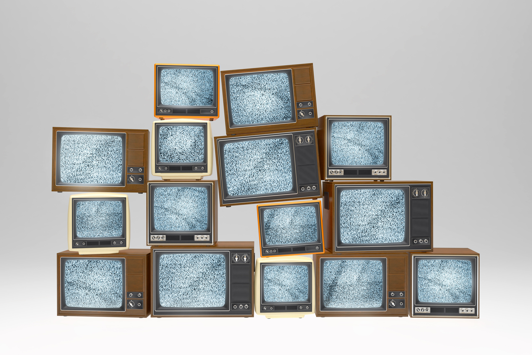 Stack of vintage old televisions showing static signal